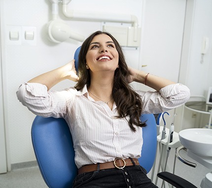 Woman smiles while visiting her Hillsboro sedation dentist