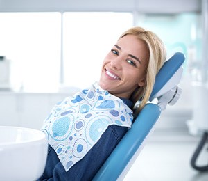 Smiling woman sitting in dental office